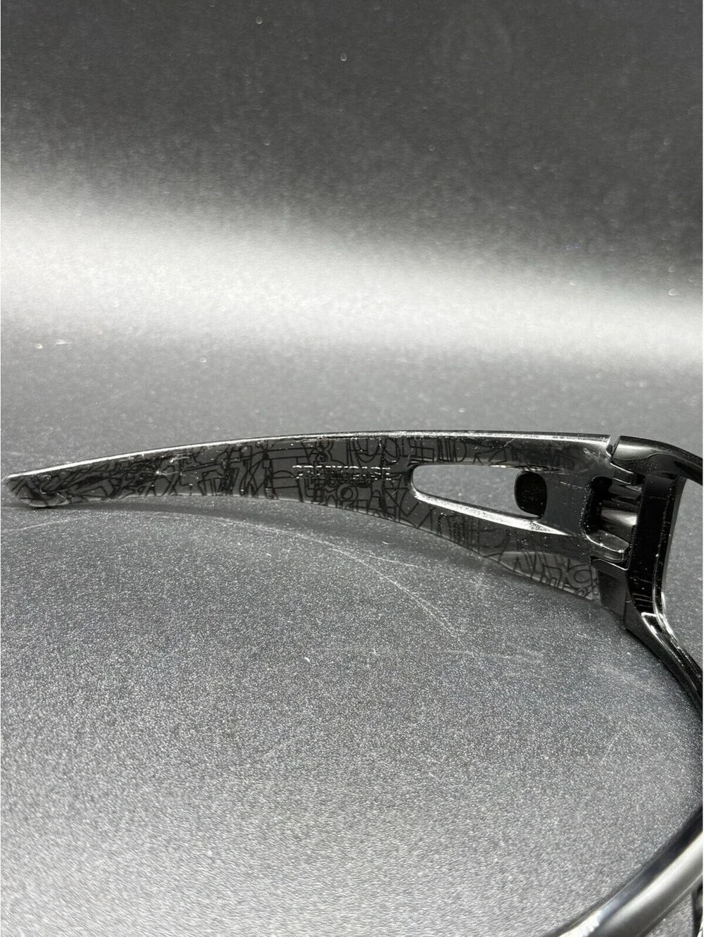 Oakley Crankcase Polished Black/Dark Grey History Text Frame (No Icons)